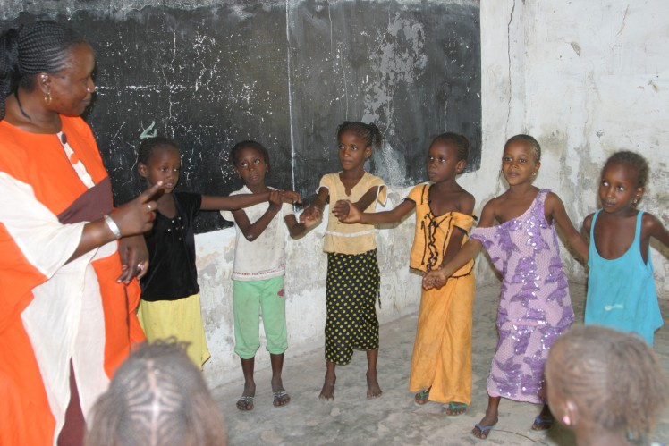 Singing and dancing schoolchildren.