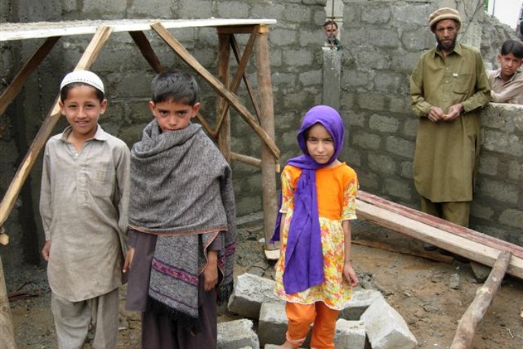 3 Pakistani children in traditional dress