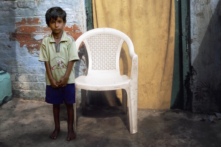 A little boy who is the head of the family.